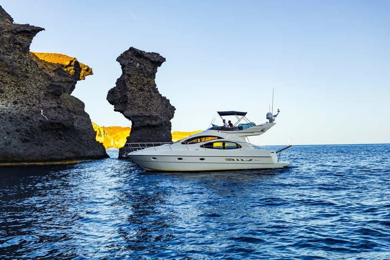 Santorini: Private Yacht Experience of Timeless Elegance - Red and White Beach Pass-By: Seeing Color Without the Sand Work