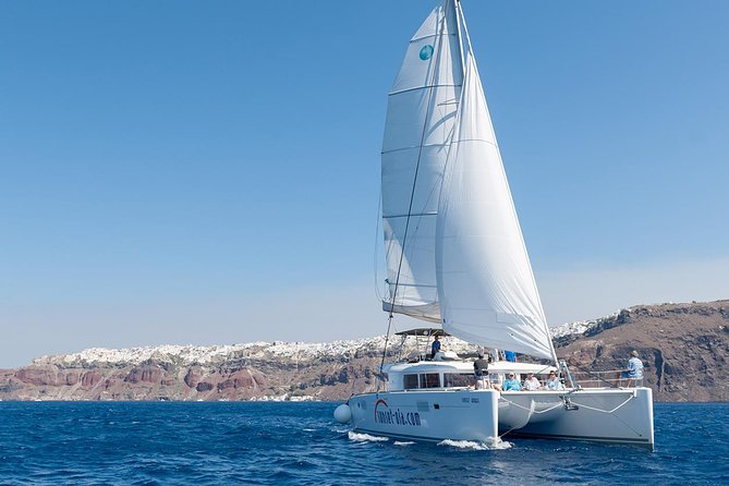 Santorini Small-Group Catamaran Sailing Trip(BBQ,drinks, transfer) - White Beach + onboard BBQ: where the day really clicks