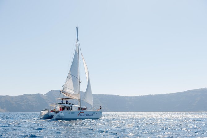 Santorini Small-Group Catamaran Sailing Trip(BBQ,drinks, transfer) - Ancient lighthouse view from the sea