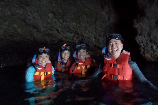 Santorini Stand-Up Paddle and Snorkel Adventure - Paddling off Santorini’s coast: cliffs, a remote area, and wind-aware routes