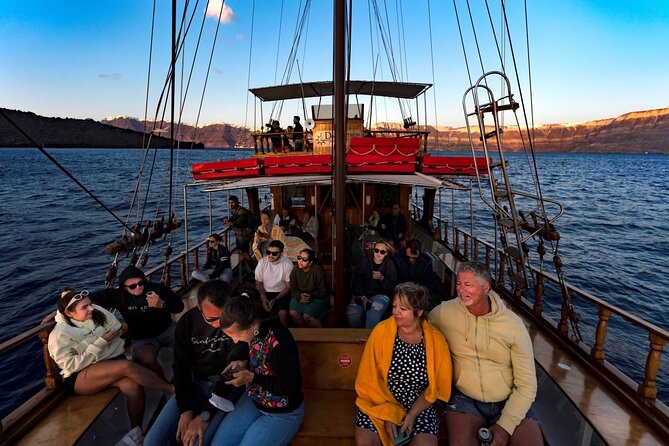 Santorini Sunset Cruise in Caldera - Caldera Sailing After Sunset: Wine, Music, and Cliff-Edge Photos