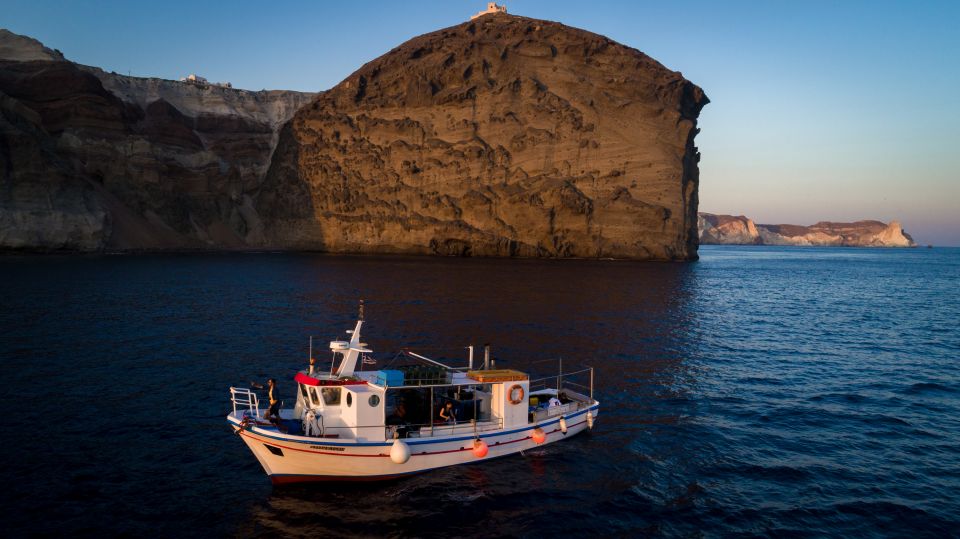 Santorini Sunset Fishing Trip with Dinner and Drinks - Cruising past the Red, White, and Black Beaches