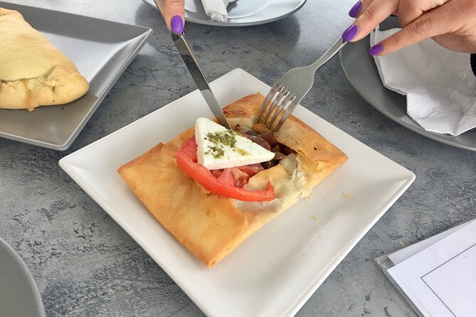 Santorini Sunset Walking Tour inc. tastings and 5 drinks - Firostefani caldera paths: liqueur, a sweet bite, and big sea views