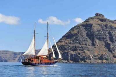 Santorini Volcanic Sunset Cruise - The caique boat: comfort, shade, and real-world pace