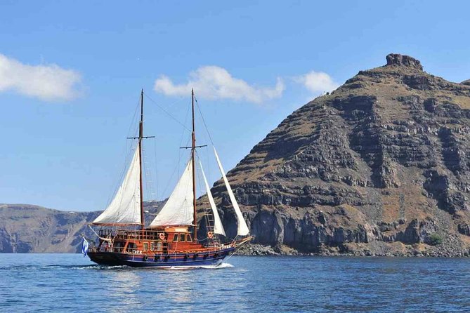 Santorini Volcanic Sunset Cruise - The caique boat: comfort, shade, and real-world pace