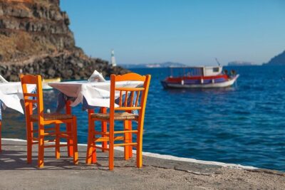 SUV Santorini Highlights Private Tour - Entering Oia: white houses, blue domes, and the castle viewpoint vibe